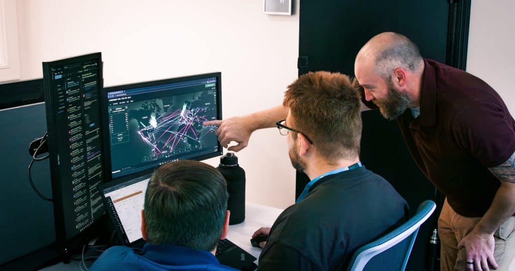 Blackpoint Cybersecurity analysts looking at cyber attacks on a computer