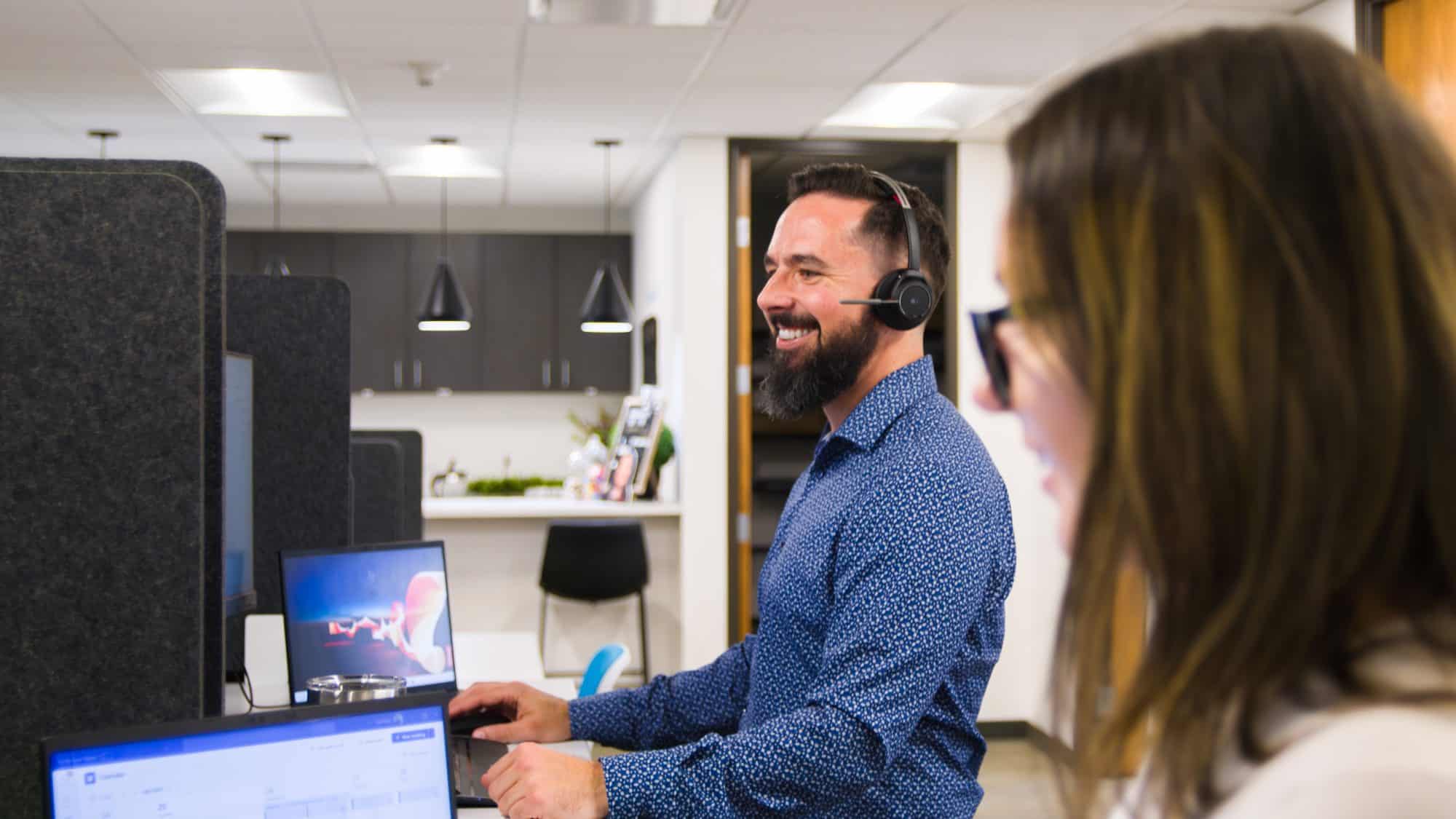 Employees working as a team to provide exceptional IT support to clients