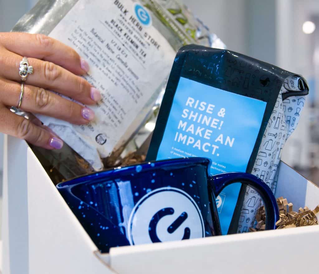 Hand packing a culture box with sustainable materials