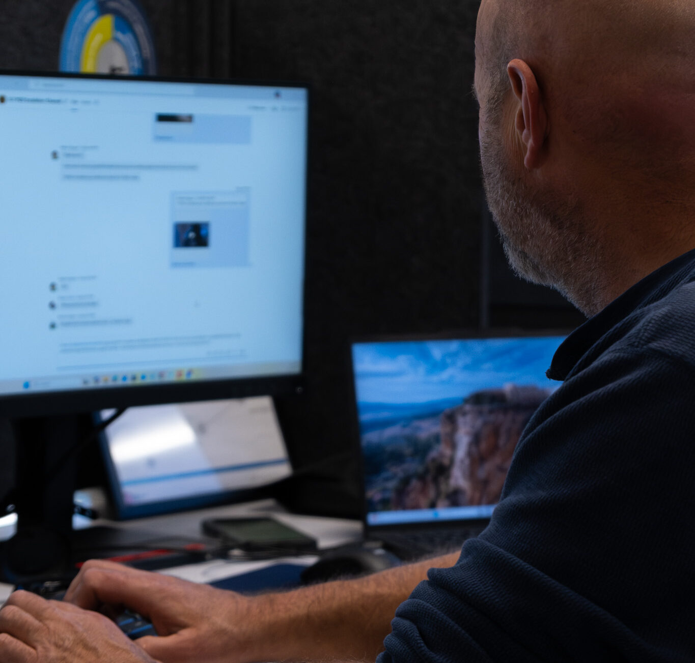 A man staring at a desktop computer.