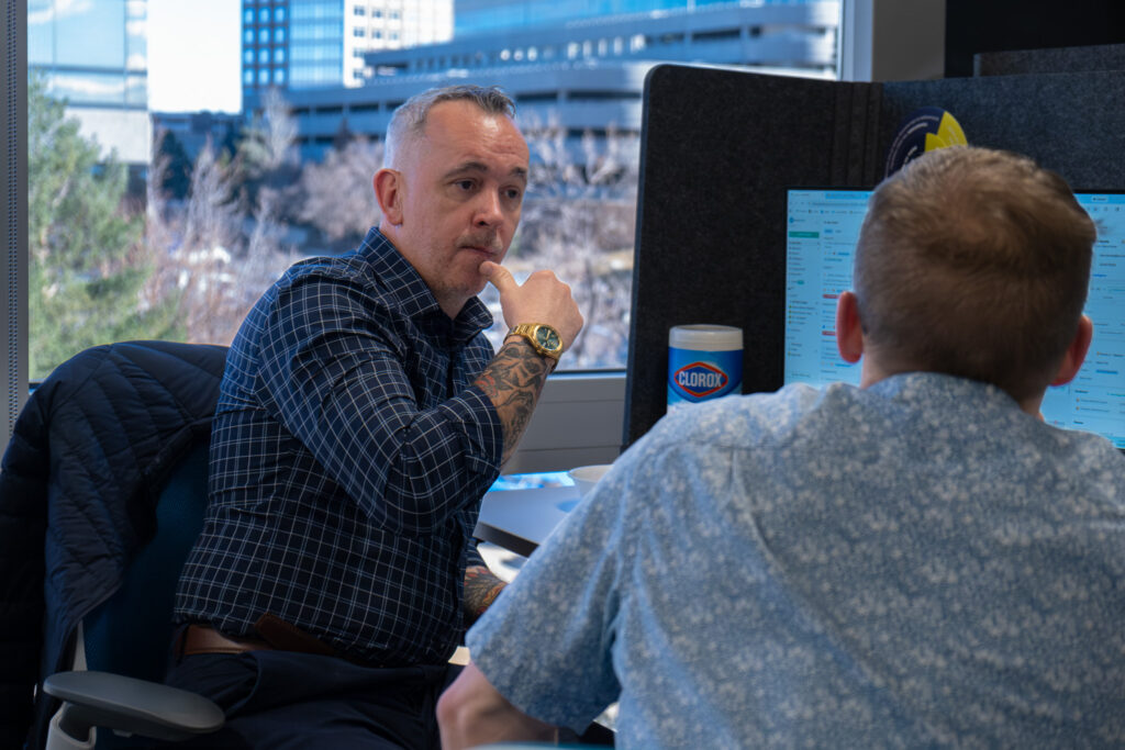 A man talking with a technician.