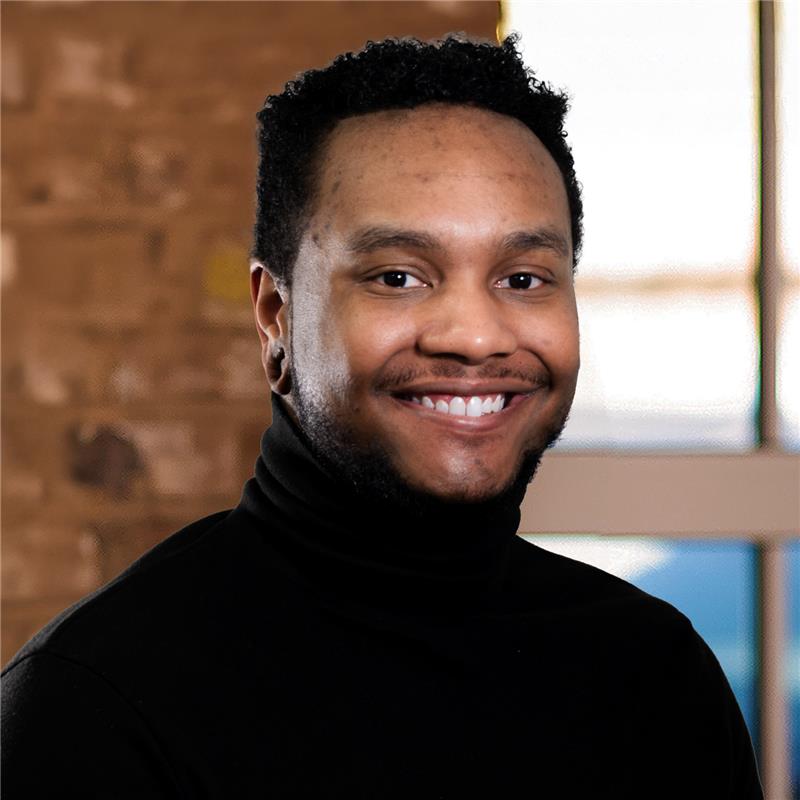 Headshot of Dré Murphy.