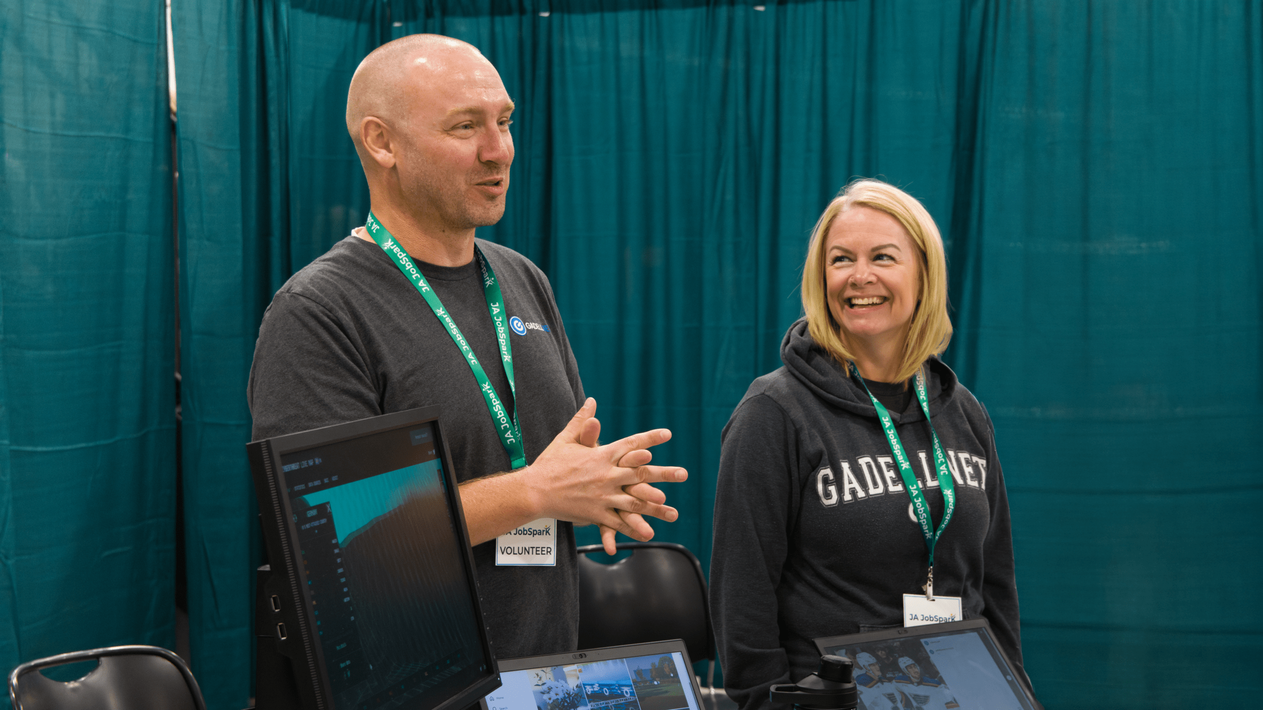 Man and woman presenting at volunteer event